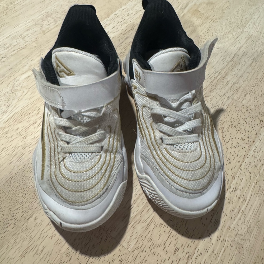 Kids White and Gold Nike Sneakers